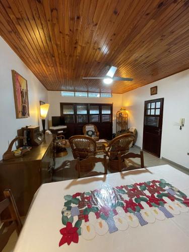 a living room with a table and a dining room at CD House in Fort-de-France