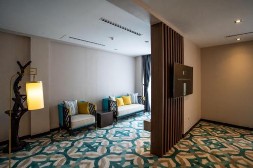 a lobby of a hotel with a waiting room at CHRISTEE SUITES HOTEL in Melaka