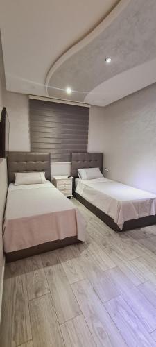 Postel nebo postele na pokoji v ubytování Apartamientos edificio mekad