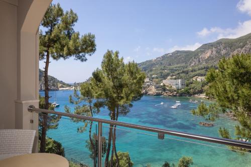 a view of a river from a balcony at Akrotiri Beach Resort Hotel - Adult Friendly in Paleokastritsa