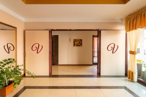 an entrance to a room with doors open at Spa Hotel Vita in České Budějovice
