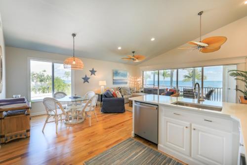 a kitchen and living room with a table and chairs at Captiva Hide A Way 2D in Captiva