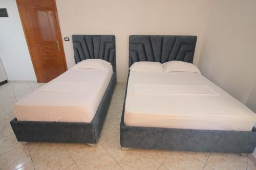 Ένα ή περισσότερα κρεβάτια σε δωμάτιο στο Hotel Vila Vilson