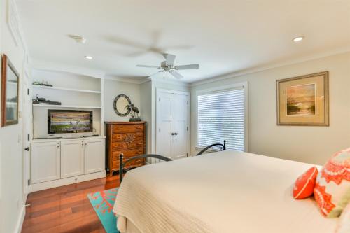 a bedroom with a bed and a tv at Captiva Hide A Way 2B in Captiva