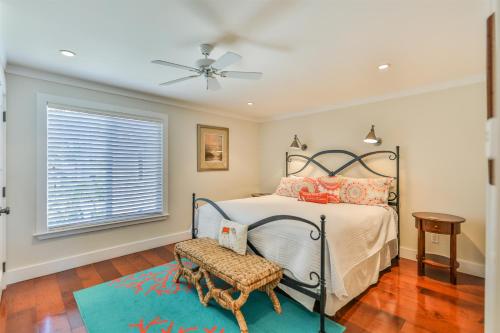 a bedroom with a bed and a ceiling fan at Captiva Hide A Way 2B in Captiva