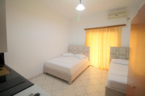 Ένα ή περισσότερα κρεβάτια σε δωμάτιο στο Hotel Vila Vilson