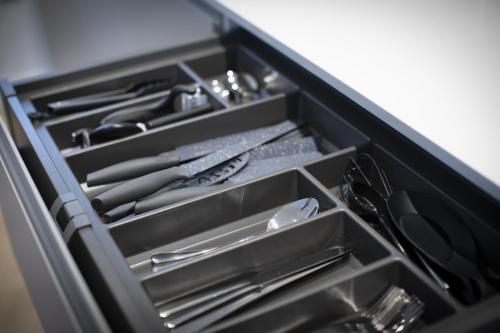 a drawer filled with utensils in a kitchen at Charlecote House in Bath