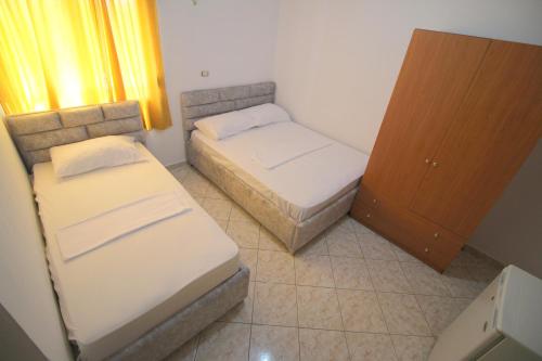 Ένα ή περισσότερα κρεβάτια σε δωμάτιο στο Hotel Vila Vilson