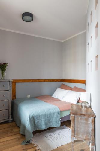 Katil atau katil-katil dalam bilik di Apartament Stare Miasto