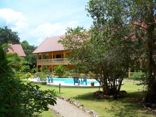 a house with a swimming pool in the yard at Sabai Residence in Ao Nang Beach