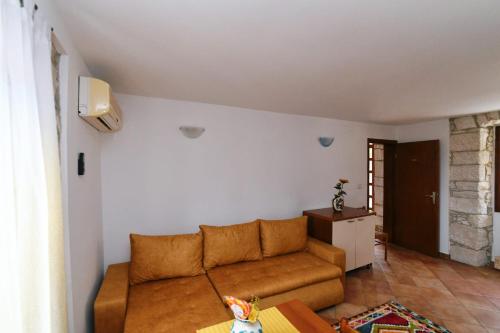 a living room with a couch and a table at Freya's Apartments Medulin in Medulin