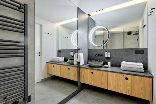 a bathroom with a sink and a mirror at Harda House Friends & Spa in Zakopane