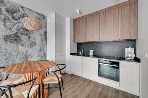 Kuchyňa alebo kuchynka v ubytovaní Gdańsk Comfort Apartaments Łąkowa