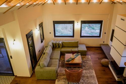 a living room with a couch and a table at Villa de Vino in Ioannina