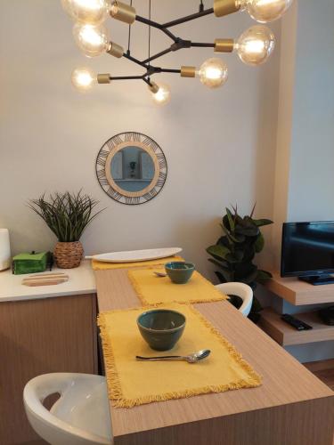 a kitchen with a table with two bowls on it at Charming Central Studio with AC in Porto