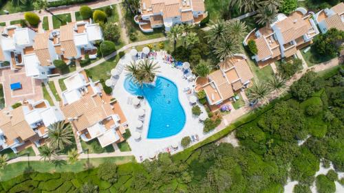 an aerial view of a resort with a swimming pool at Grupotel Aldea Cala'n Bosch in Cala'n Bosch