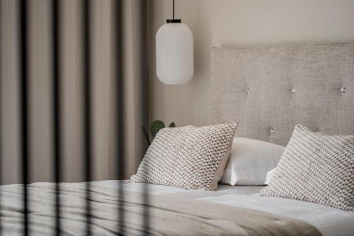 Letto o letti in una camera di ALFA LUXURY APARTMENTS