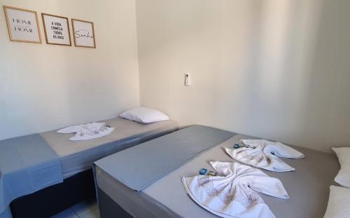 Katil atau katil-katil dalam bilik di APARTAMENTO CHARMOSO em Petrolina 2 quartos com ar cond e wi-fi 300MB