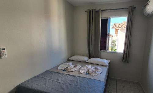 Katil atau katil-katil dalam bilik di APARTAMENTO CHARMOSO em Petrolina 2 quartos com ar cond e wi-fi 300MB