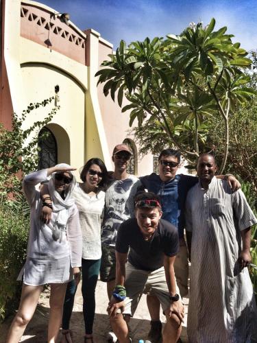 a group of people posing for a picture in front of a building at Nubian Holiday House Aswan in Aswan
