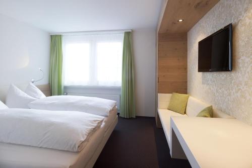 Ein Bett oder Betten in einem Zimmer der Unterkunft Anker Hotel Restaurant