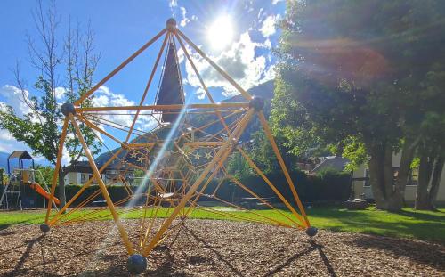 a metal structure on a playground in a park at Appartamento Al Brenz in Croviana