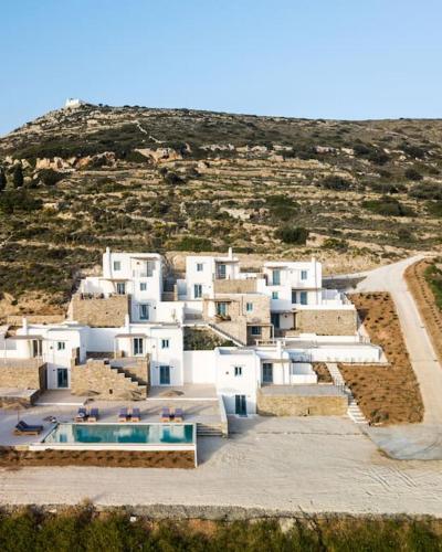 a group of white buildings on top of a hill at Serenity Villa w/ Pool in Butterfly Valley in Kampos Paros