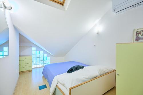 Postel nebo postele na pokoji v ubytování Joyful Place