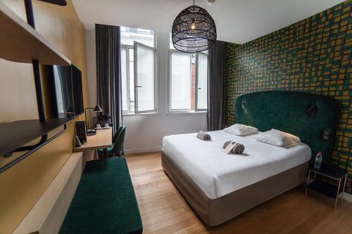 Postel nebo postele na pokoji v ubytování Hotel Kanaï
