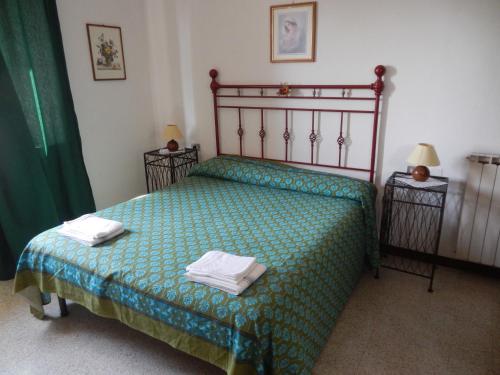 En eller flere senge i et værelse på Residence il Colle