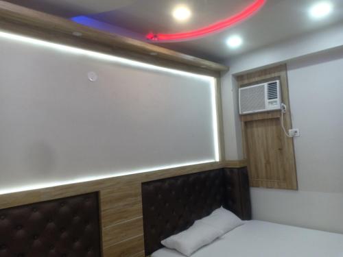 Postel nebo postele na pokoji v ubytování HN Palace Homestay