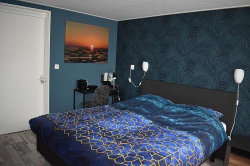 מיטה או מיטות בחדר ב-Hotel Dichtbijzee
