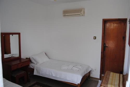 Ένα ή περισσότερα κρεβάτια σε δωμάτιο στο Hotel Hisarlık