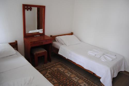 Ένα ή περισσότερα κρεβάτια σε δωμάτιο στο Hotel Hisarlık