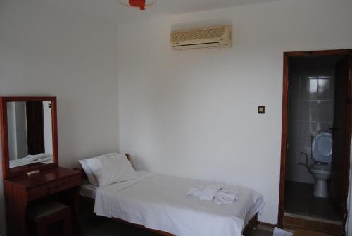 Ένα ή περισσότερα κρεβάτια σε δωμάτιο στο Hotel Hisarlık