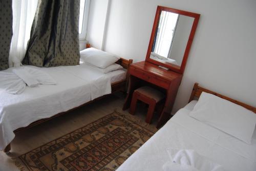 Ένα ή περισσότερα κρεβάτια σε δωμάτιο στο Hotel Hisarlık