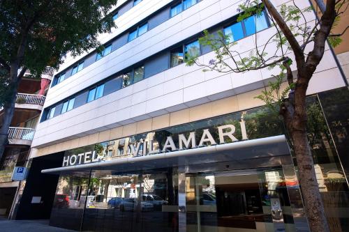 a building with a hotel malawiemen sign on it at Hotel Vilamarí in Barcelona