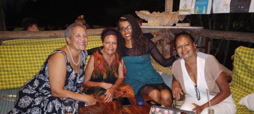 a group of women sitting on a couch at Stilts Diani Beach in Diani Beach