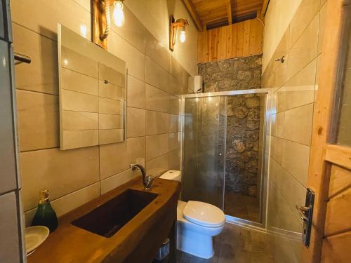 a bathroom with a sink and a toilet at Kabak Ütopya Kamp in Faralya