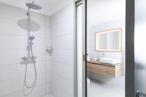 a bathroom with a shower and a sink at RESIDENCE SANTA MARIA in LʼÎle-Rousse