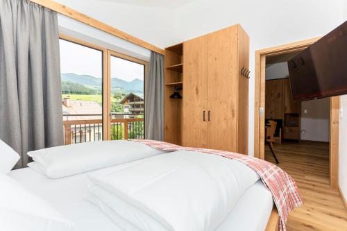 Postel nebo postele na pokoji v ubytování Feriengut Ottacherhof - Active Family Holiday in central Hollersbach