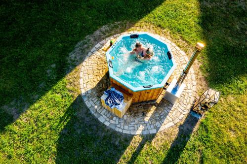 an overhead view of a pool with two people in it at Ferienhof Domäne Groschwitz in Rudolstadt