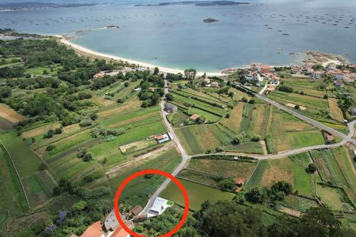 an aerial view of a house with a red circle at Casiña de Cris in Boiro