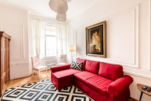 Golden Esthetic with Red Sofa Apartment
