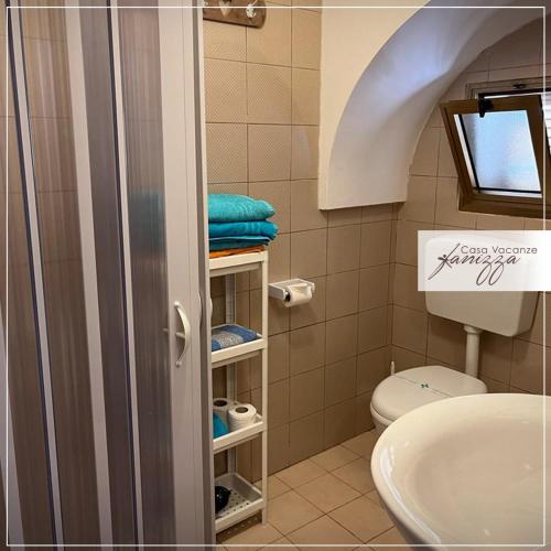 a bathroom with a toilet and a sink at trullo a volte a stella in Alberobello