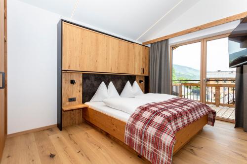 Postel nebo postele na pokoji v ubytování Feriengut Ottacherhof - Active Family Holiday in central Hollersbach