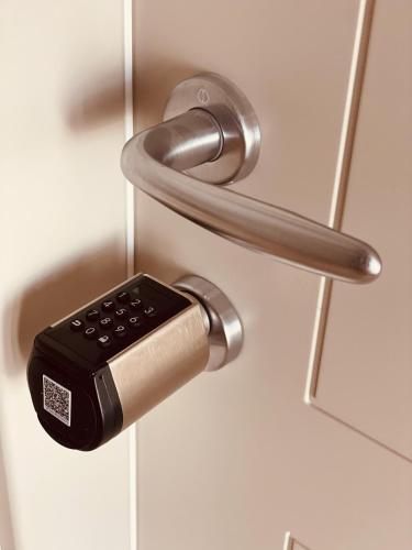 a door handle with a remote control in it at A casa di Alberta B&B Relais in Rotondella