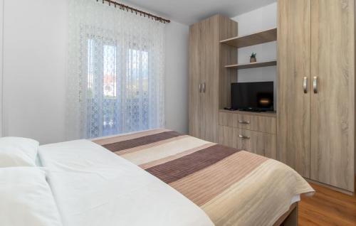 Posteľ alebo postele v izbe v ubytovaní APP 4+1 s dvije spavaće sobe