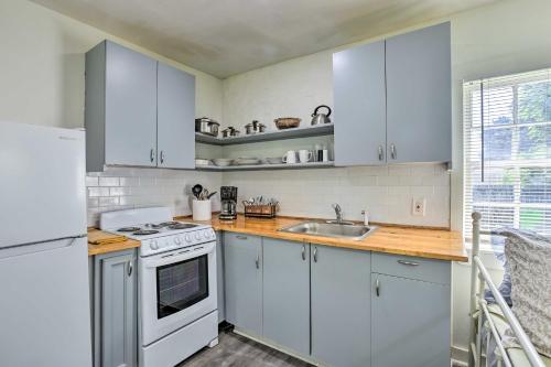 a kitchen with white appliances and wooden counter tops at Quaint Leeds Studio with Yard about 18 Mi to Birmingham! in Leeds