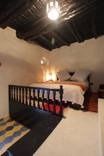 a bedroom with a bed in a room at Riad Beldy in Essaouira